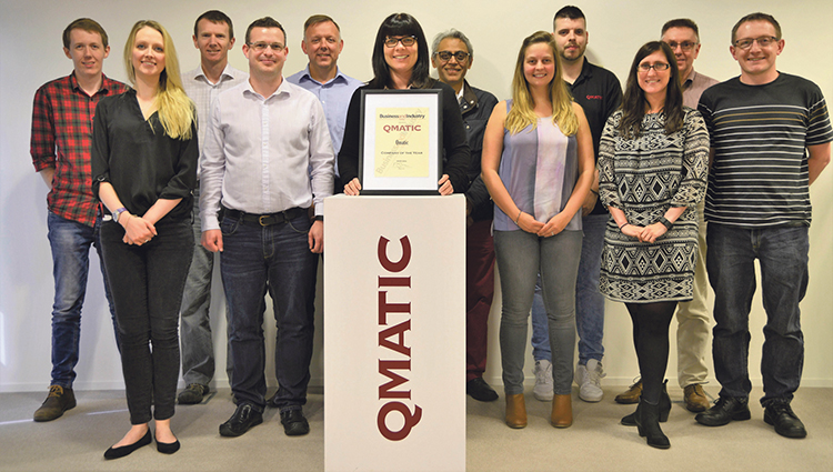 Qmatic team receives the Company of the Year Award from our journalist